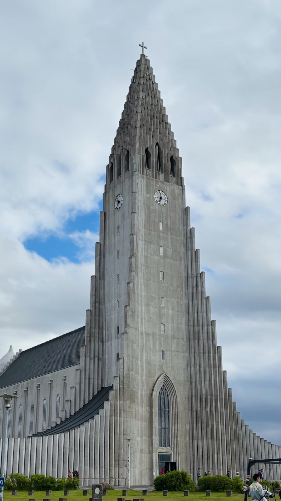 The tall stepped concrete tower of Hallgrimskirkja church under a cloudy sky
